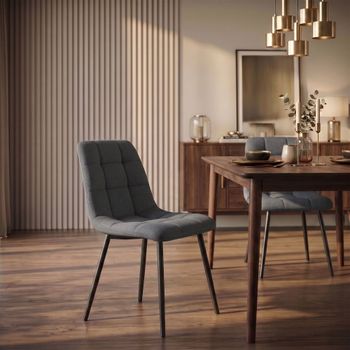 Silla con patas de metal y asiento en tela gris