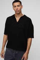 polo oversize recto con costuras geometricas negro