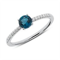 anillo de diamantes en oro blanco 14 quilates con topacio azul