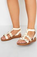sandalias blancas con tachas estilo gladiador