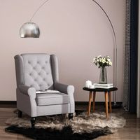 sillon orejero gris de una plaza con capitone 74  86  102 cm