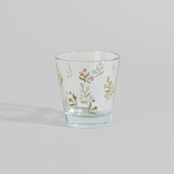 Vaso de vidrio transparente con flores