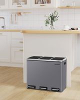 cubo de basura con 3 compartimentos de acero de color gris y negro