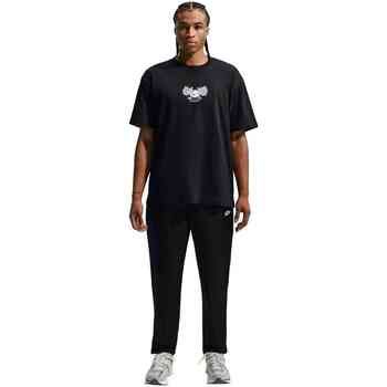 Nike Tops y Camisetas Club Pantalón Entallado De Tejido Woven para hombre