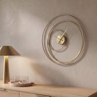 reloj de pared con circulos de acero dorado d 60 cm