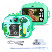 rs ware - camara instantanea para ninos con diseno de dinosaurio verde 1080p con selfie video hd musica mp3 y 4 juegos integrados incluye 3 rollos de papel termico