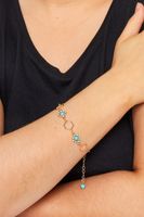 pulsera dorada con piedra color turquesa