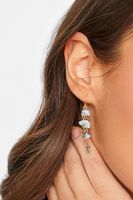 pendientes largos dorados de estrellas y piedras