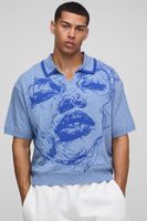 polo oversize de punto jacquard con cara azul