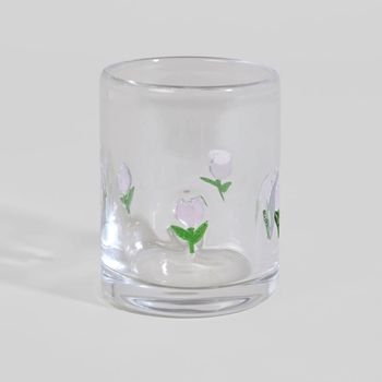 Vaso de vidrio transparente con flor