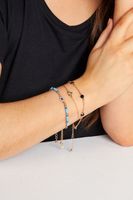 juego 3 pulseras doradas con cuentas azules