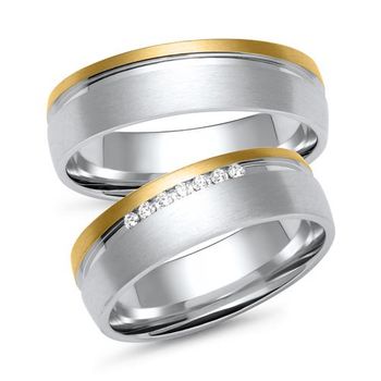 Alianzas en oro blanco y amarillo con 7 diamantes