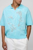 polo oversize de punto jacquard con cara verde