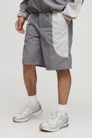 pantalon corto holgado de nailon con cintura elastica y colores en bloque gris