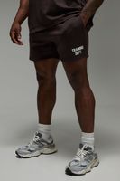 pantalon corto man active oversize de tela jersey con estampado training dept brown
