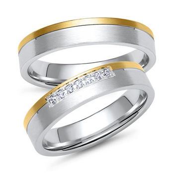 Alianzas en oro amarillo y blanco con 7 diamantes
