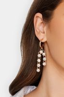 pendientes dorados aro con borlas