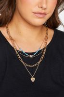 juego 4 collares dorados con dije de ojos