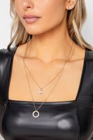 conjunto dorado de collar doble altura y pendientes boton