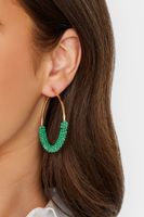 pendientes dorados de aros con cuentas verdes