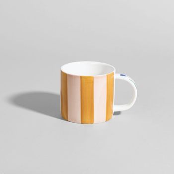 Taza de gres a rayas con flor multicolor