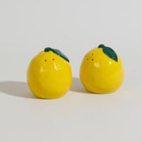 salero y pimentero en forma de limones de gres