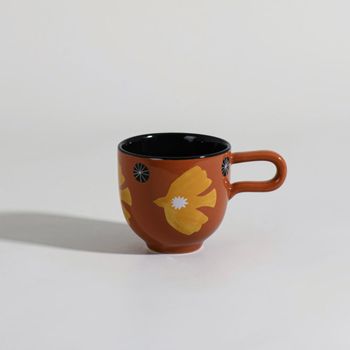 Taza de gres marrón y amarillo con pájaro
