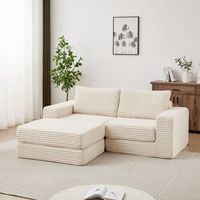 sofa cama modular de pana beige con modulos combinables y reposapies movil