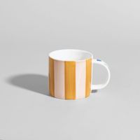taza de gres a rayas con flor multicolor