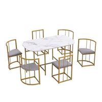 conjunto de comedor con mesa blanca y 6 sillas grises estructura de hierro dorado