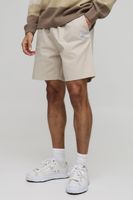 pantalon corto holgado de lona con etiqueta de tela y cintura elastica beige