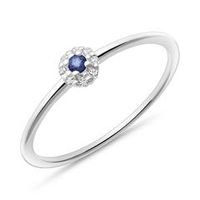 anillo de oro blanco de 14 quilates con zafiro y topacios blancos