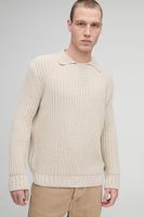 polo oversize de punto grueso con solapa beige