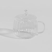 taza con forma de calabaza y tapa de vidrio