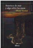 Asterisco de mar y alga sobre las rocas