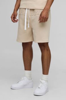 Pantalón Corto Oversize Con Caída En La Entrepierna Y Estampado Worldwide En Relieve, Beige