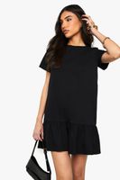 vestido holgado de algodon con volante y caida en el bajo negro