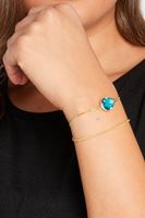juego 2 pulseras finas doradas con lagrima azul