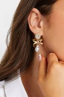 pendientes de lazo dorado con perla