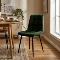 silla con patas de metal y asiento en terciopelo verde