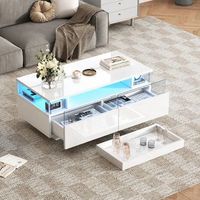 mesa de centro blanca brillante con dos cajones bandeja extraible y luz led