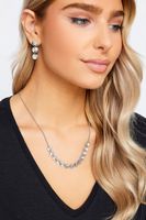 conjunto collar y pendientes plateados de discos