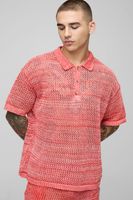 polo oversize de punto retorcido con botones y cuello rojo