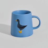 taza de gres azul con canard en relieve