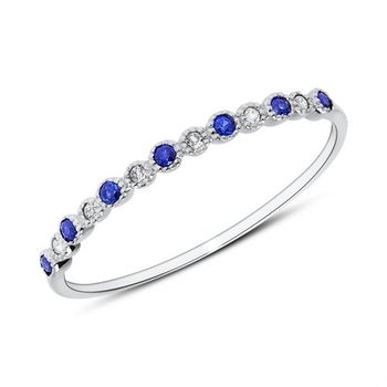 Anillo de oro blanco 14 quilates con zafiros y topacios blancos