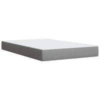 cama gris claro con colchon
