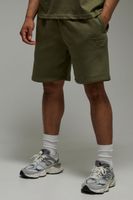 pantalon corto man active holgado con estampado training dept verde
