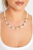 collar dorado de piedras blancas