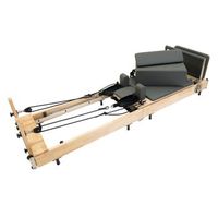 reformer de pilates plegable de roble con funda y accesorios