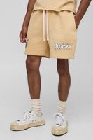 pantalon corto holgado con lavado a la piedra y estampado grafico de motociclismo beige